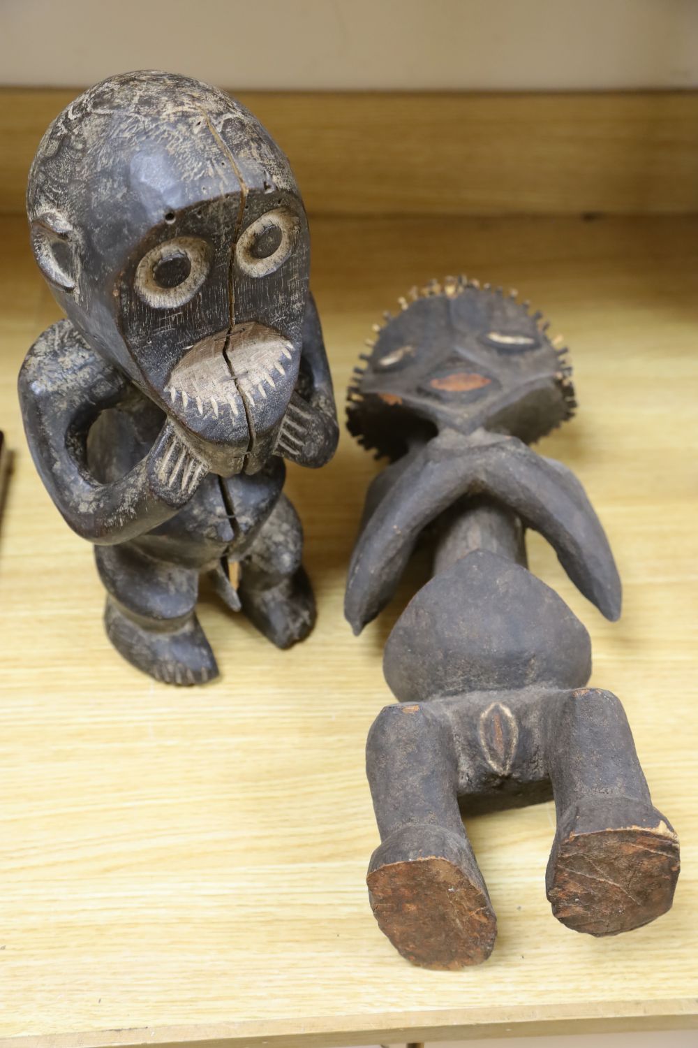 Two Mabila wood figures, one with peg hair, tallest 49cm